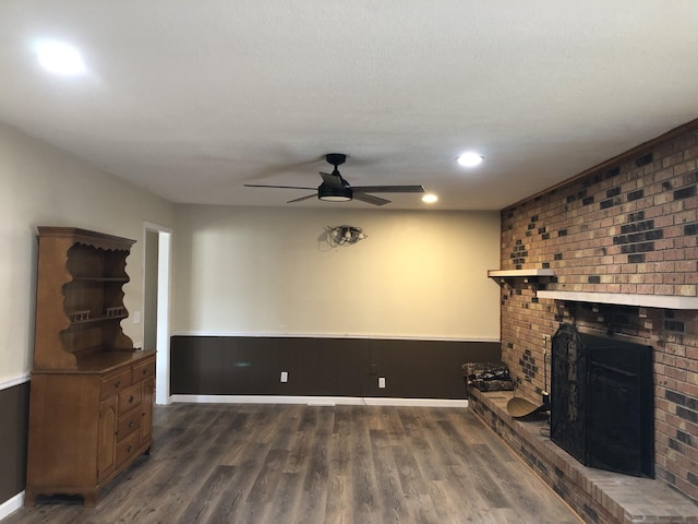 233 W Chestnut St, Puryear, TN 38251 - unfurnished living room with a brick fireplace, wood finished floors, a ceiling fan, and recessed lighting
