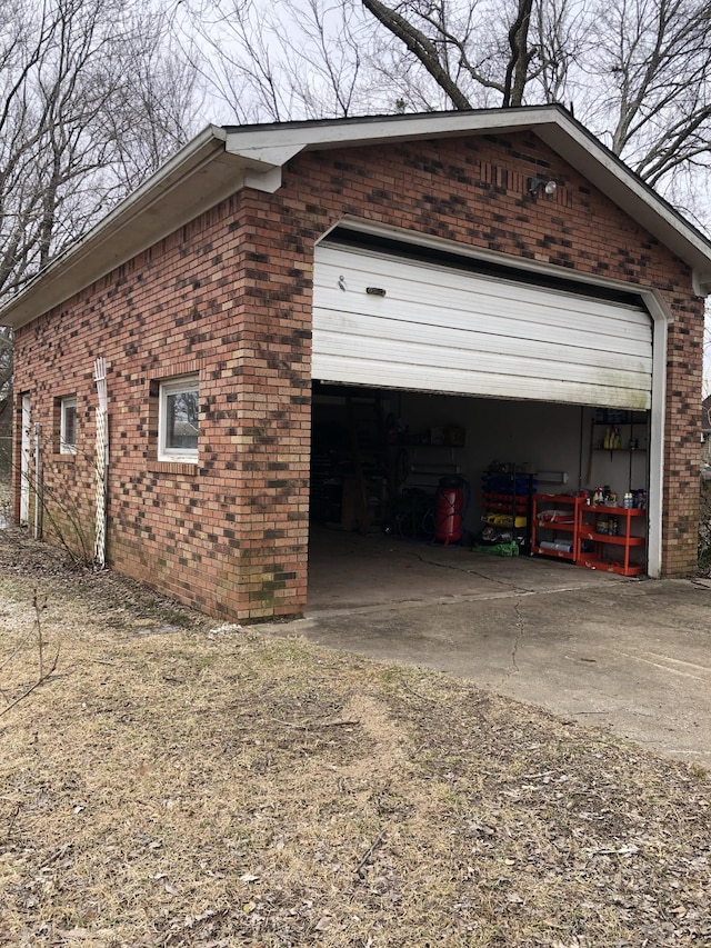 233 W Chestnut St, Puryear, TN 38251 - garage featuring driveway
