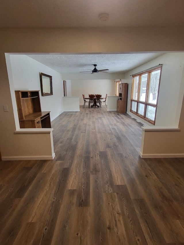 233 W Chestnut St, Puryear, TN 38251 - hall with dark wood-style flooring and a textured ceiling