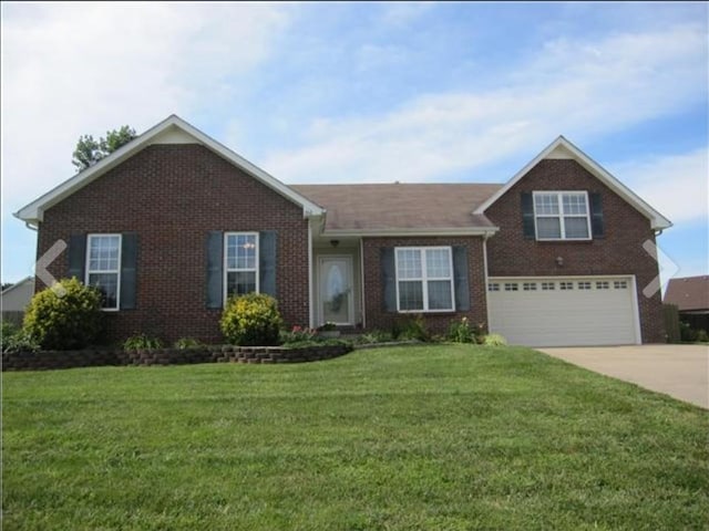 366 Woodtrace Dr, Clarksville, TN 37042 - view of front of property featuring brick siding, an attached garage, concrete driveway, and a front yard