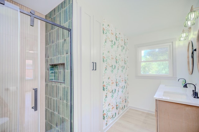 445 High Point Rd, Clarksville, TN 37042 - bathroom with double vanity, a stall shower, wood finished floors, and wallpapered walls