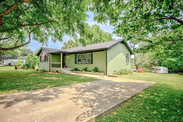 445 High Point Rd, Clarksville, TN 37042 - ranch-style house featuring a front yard, brick siding, an outdoor structure, and a porch
