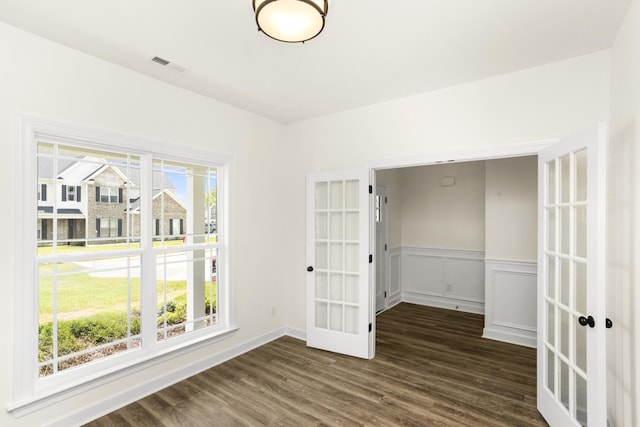 4026 Rampart Way, Spring Hill, TN 37174 - spare room featuring french doors, dark wood-style flooring, and a wainscoted wall