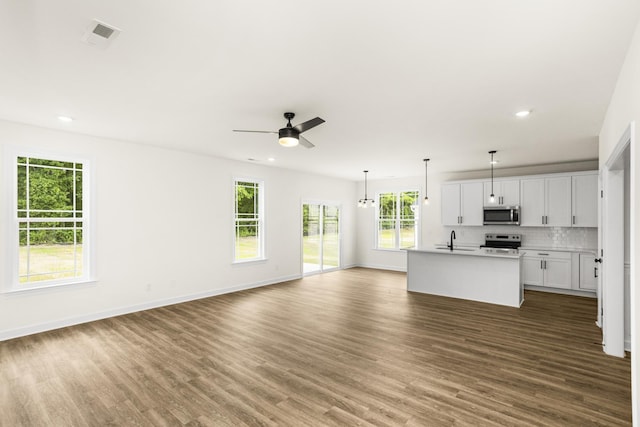 4026 Rampart Way, Spring Hill, TN 37174 - unfurnished living room with dark wood finished floors, a ceiling fan, and recessed lighting