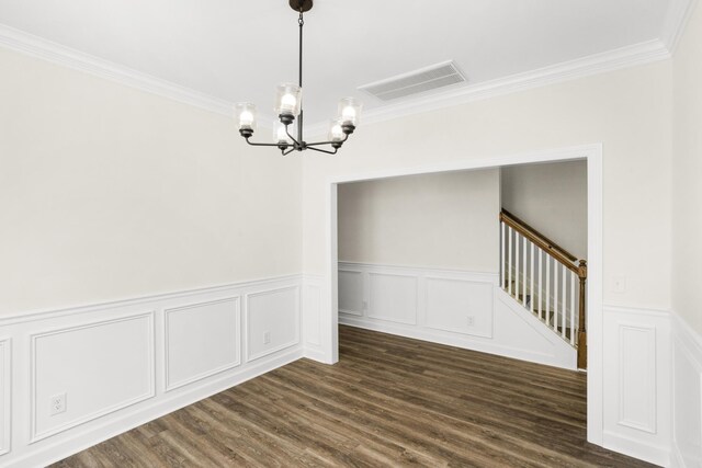 4026 Rampart Way, Spring Hill, TN 37174 - unfurnished dining area with a chandelier, ornamental molding, wainscoting, dark wood-style flooring, and a decorative wall