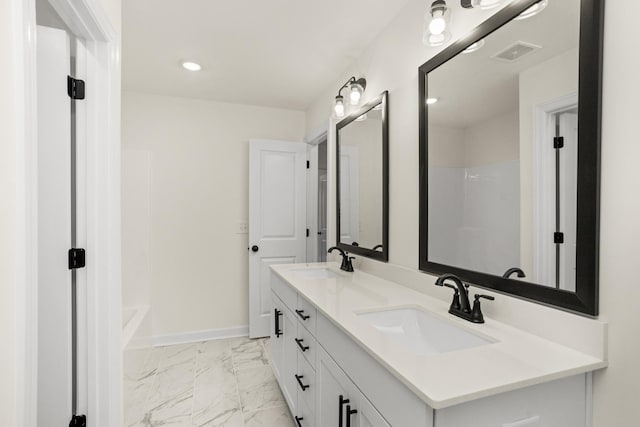 4026 Rampart Way, Spring Hill, TN 37174 - bathroom featuring double vanity, marble finish flooring, and recessed lighting