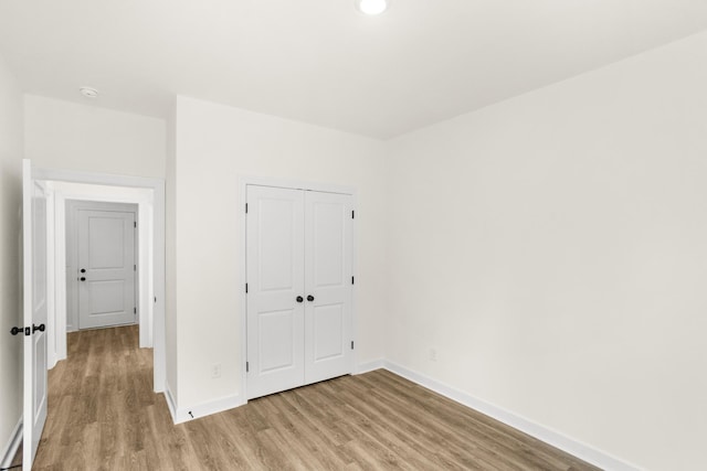 4026 Rampart Way, Spring Hill, TN 37174 - unfurnished bedroom featuring light wood-type flooring, a closet, and recessed lighting