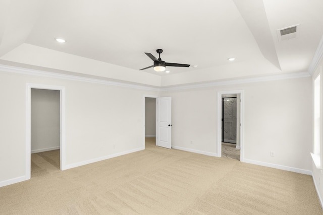 4026 Rampart Way, Spring Hill, TN 37174 - unfurnished bedroom featuring a raised ceiling, a walk in closet, light carpet, recessed lighting, and crown molding