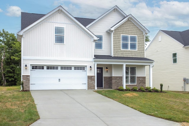 4026 Rampart Way, Spring Hill, TN 37174 - view of front of home with a front lawn, a garage, concrete driveway, brick siding, and covered porch