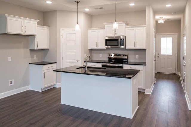 30 Cherry Acres, Clarksville, TN 37042 - kitchen featuring appliances with stainless steel finishes, dark countertops, dark wood-style flooring, and recessed lighting
