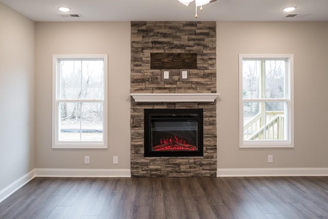30 Cherry Acres, Clarksville, TN 37042 - unfurnished living room with dark wood-style floors, healthy amount of natural light, and a stone fireplace
