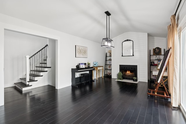 2117 Strombury Dr, Hermitage, TN 37076 - living room with lofted ceiling, a large fireplace, wood finished floors, and stairway