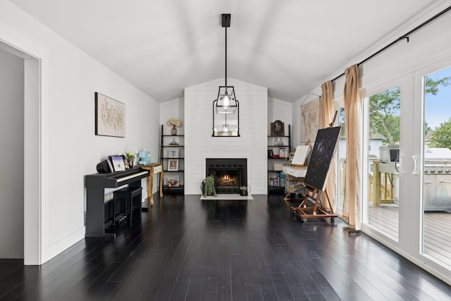 2117 Strombury Dr, Hermitage, TN 37076 - living area featuring vaulted ceiling, a fireplace, and wood finished floors