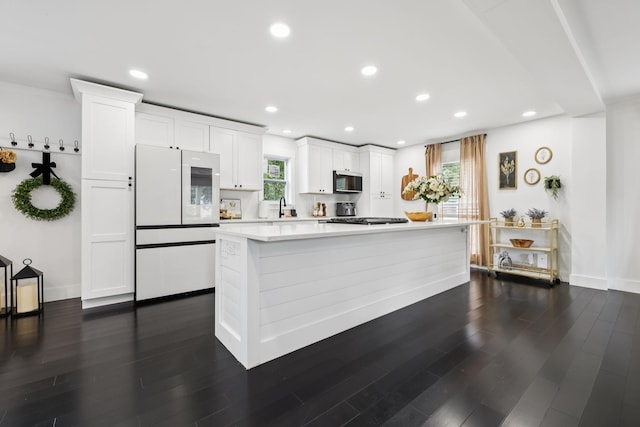 2117 Strombury Dr, Hermitage, TN 37076 - kitchen featuring stainless steel appliances, light countertops, white cabinetry, healthy amount of natural light, and recessed lighting
