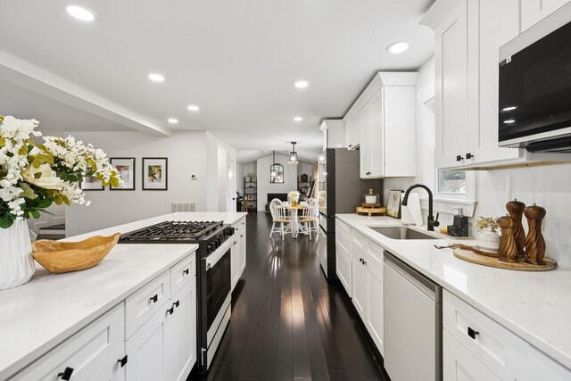 2117 Strombury Dr, Hermitage, TN 37076 - kitchen with appliances with stainless steel finishes, white cabinets, recessed lighting, dark wood-type flooring, and light stone countertops