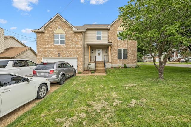 2117 Strombury Dr, Hermitage, TN 37076 - view of front of property with an attached garage, brick siding, a front lawn, and driveway