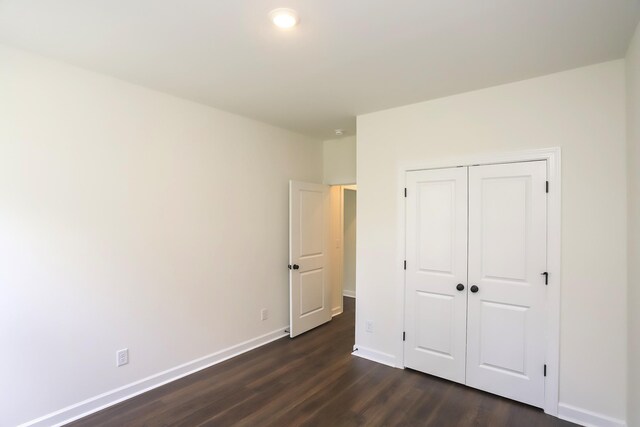 4020 Rampart Way, Spring Hill, TN 37174 - unfurnished bedroom featuring dark wood finished floors and a closet