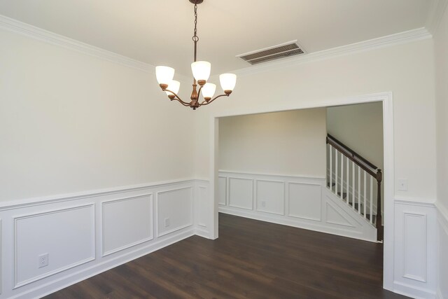 4020 Rampart Way, Spring Hill, TN 37174 - unfurnished room with crown molding, a chandelier, a wainscoted wall, dark wood-style flooring, and a decorative wall