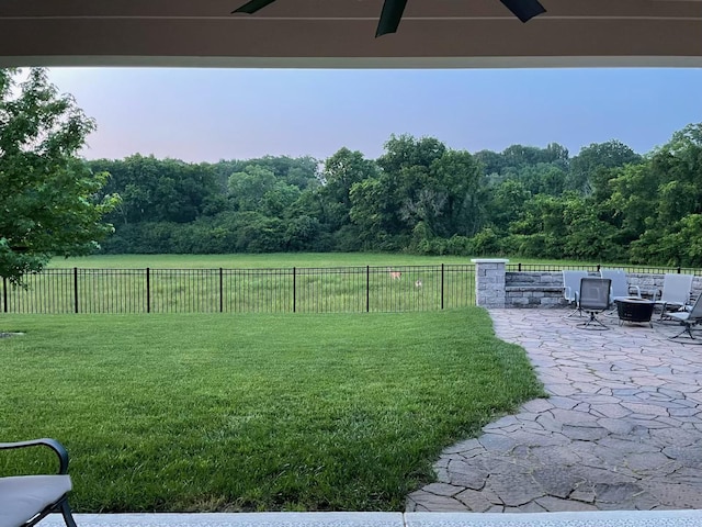 2050 Beamon Dr, Franklin, TN 37064 - view of yard with ceiling fan, a patio area, a forest view, and a fire pit