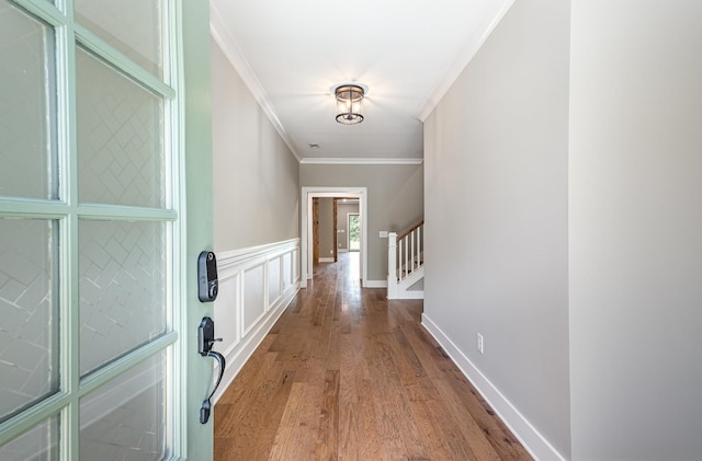 2050 Beamon Dr, Franklin, TN 37064 - entrance foyer with ornamental molding, wood finished floors, stairway, and a wainscoted wall