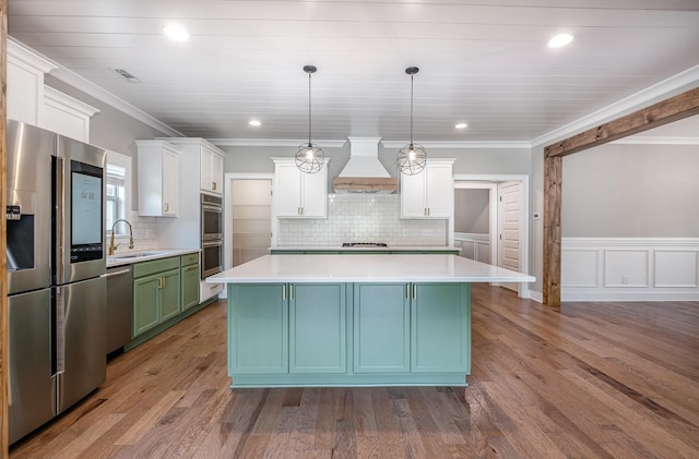 2050 Beamon Dr, Franklin, TN 37064 - kitchen with appliances with stainless steel finishes, custom exhaust hood, a center island, white cabinets, and recessed lighting