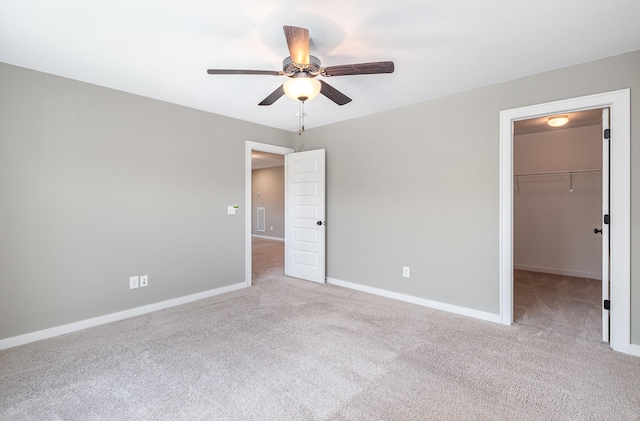 2050 Beamon Dr, Franklin, TN 37064 - unfurnished bedroom with carpet flooring, a walk in closet, a closet, and ceiling fan