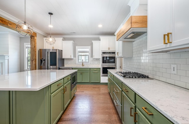 2050 Beamon Dr, Franklin, TN 37064 - kitchen featuring green cabinetry, appliances with stainless steel finishes, premium range hood, white cabinetry, and tasteful backsplash