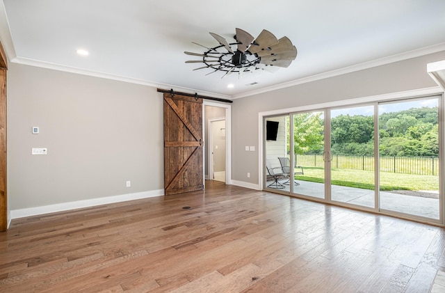 2050 Beamon Dr, Franklin, TN 37064 - unfurnished room featuring ornamental molding, a barn door, light wood-style floors, recessed lighting, and a ceiling fan