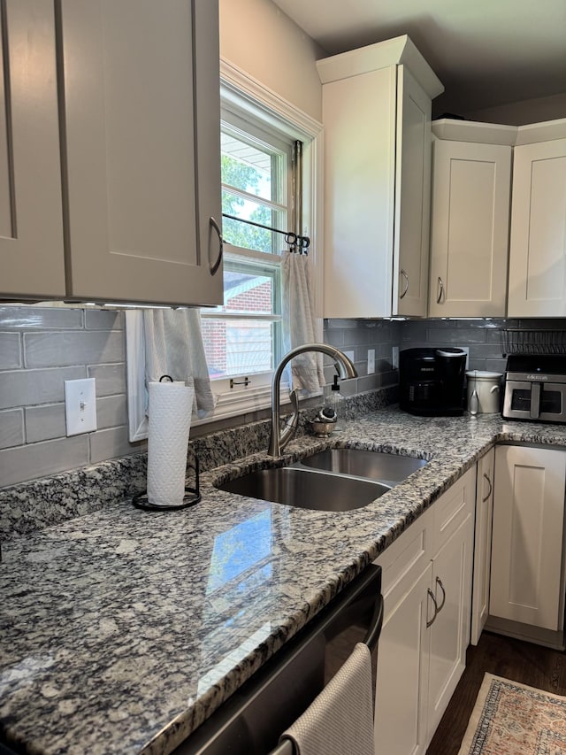 625 College Ave E, Carthage, TN 37030 - kitchen with light stone countertops, backsplash, white cabinets, and dark wood finished floors
