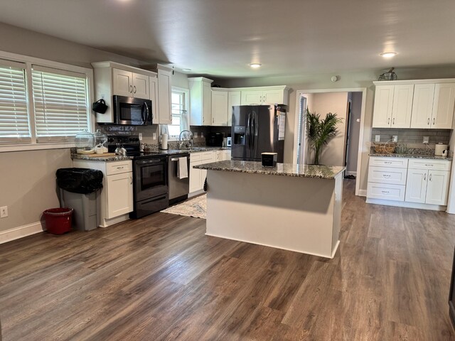 625 College Ave E, Carthage, TN 37030 - kitchen featuring black appliances, tasteful backsplash, and white cabinetry