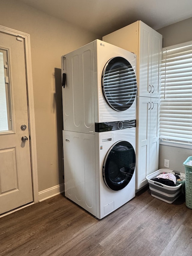 625 College Ave E, Carthage, TN 37030 - laundry area with stacked washer / drying machine, dark wood-style flooring, and cabinet space