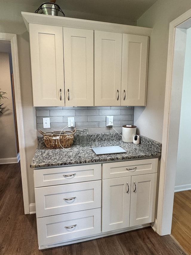 625 College Ave E, Carthage, TN 37030 - kitchen featuring dark stone countertops, white cabinets, dark wood-style floors, and tasteful backsplash