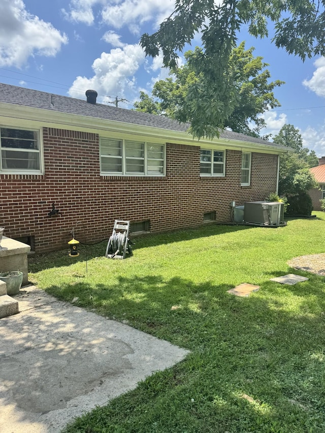 625 College Ave E, Carthage, TN 37030 - back of house featuring a lawn, brick siding, and a shingled roof