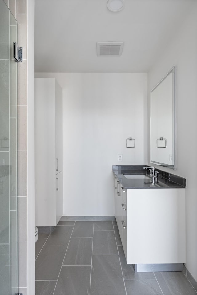 1212 Demonbreun St Unit A9 L, Nashville, TN 37203 - bathroom featuring vanity and a shower stall