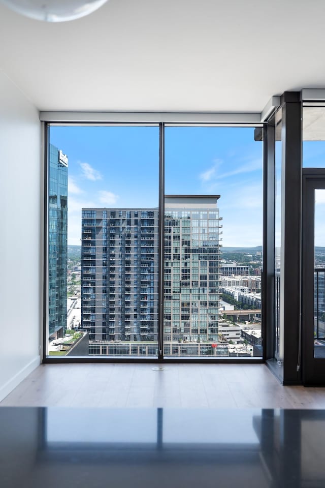1212 Demonbreun St Unit A9 L, Nashville, TN 37203 - spare room with expansive windows and a city view
