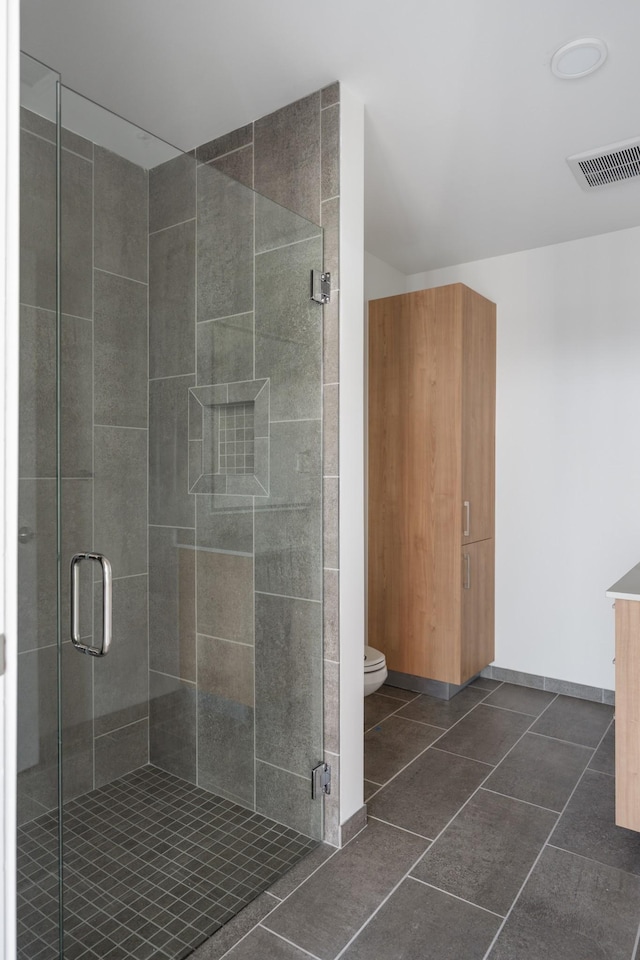 1212 Demonbreun St Unit A9 L, Nashville, TN 37203 - bathroom with a stall shower, tile patterned floors, and vanity