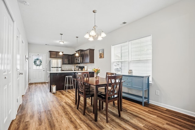 427 Rick Mccormick Dr, La Vergne, TN 37086 - dining area featuring wood finished floors and a chandelier