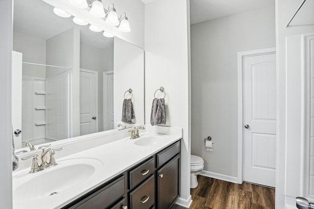 427 Rick Mccormick Dr, La Vergne, TN 37086 - bathroom featuring double vanity and wood finished floors