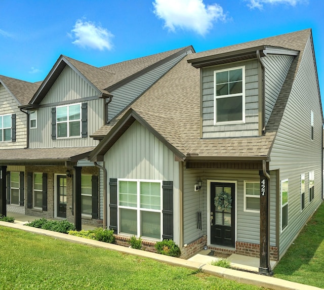 427 Rick Mccormick Dr, La Vergne, TN 37086 - multi unit property featuring board and batten siding, a front yard, and a shingled roof
