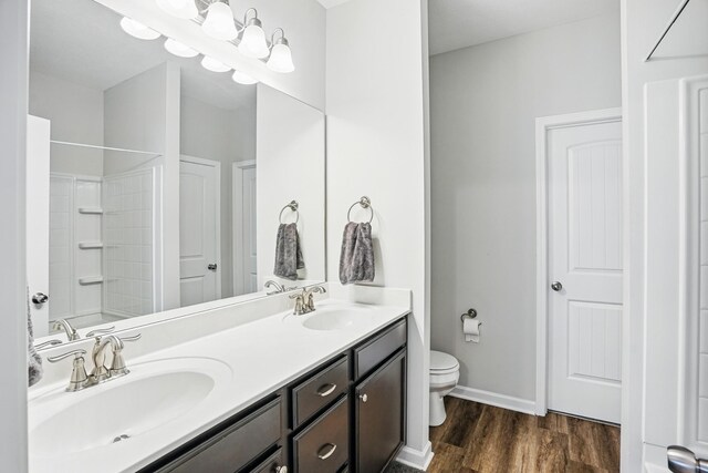 427 Rick Mccormick Dr, La Vergne, TN 37086 - bathroom featuring double vanity and wood finished floors