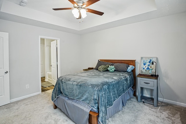 427 Rick Mccormick Dr, La Vergne, TN 37086 - bedroom featuring carpet flooring, a tray ceiling, a ceiling fan, and ensuite bath