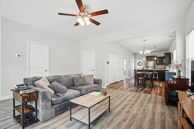 427 Rick Mccormick Dr, La Vergne, TN 37086 - living area featuring wood finished floors, ceiling fan, and a chandelier
