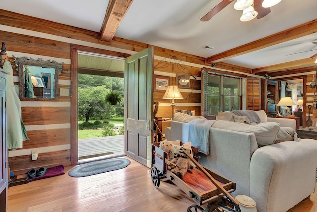 6861 Arno Allisona Rd, College Grove, TN 37046 - living room with wooden walls, a ceiling fan, beam ceiling, and wood finished floors