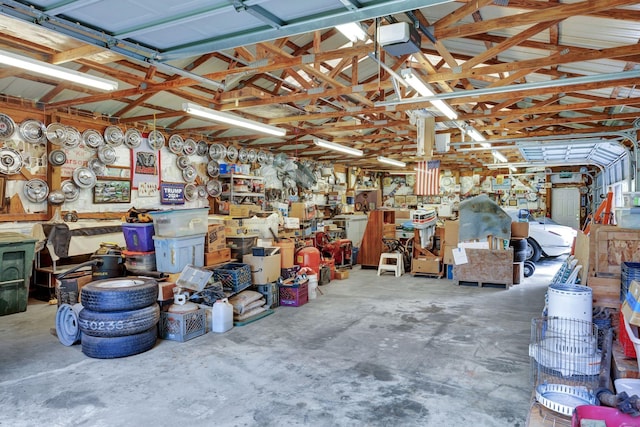 6861 Arno Allisona Rd, College Grove, TN 37046 - garage featuring a garage door opener and a workshop area