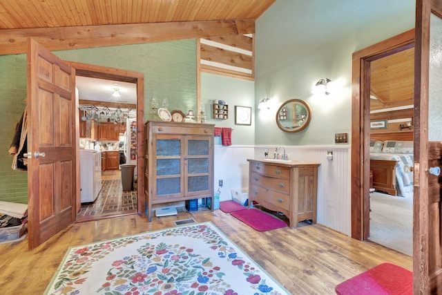 6861 Arno Allisona Rd, College Grove, TN 37046 - bathroom with washer and dryer, wainscoting, wood finished floors, vanity, and wood ceiling