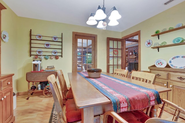6861 Arno Allisona Rd, College Grove, TN 37046 - dining area with a chandelier and light wood-style floors