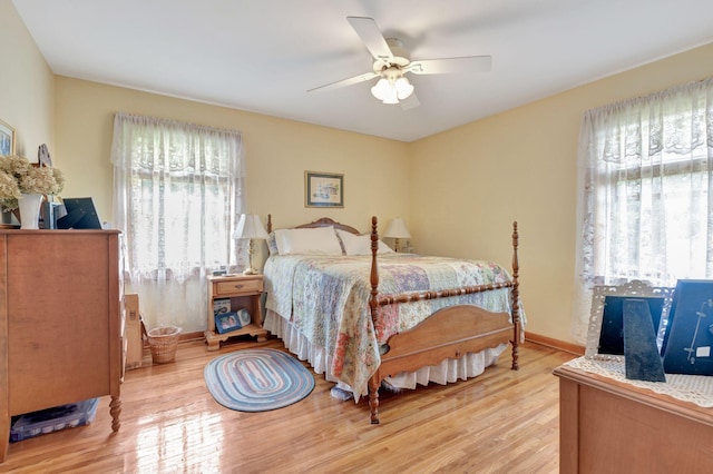 6861 Arno Allisona Rd, College Grove, TN 37046 - bedroom featuring multiple windows, wood finished floors, and ceiling fan