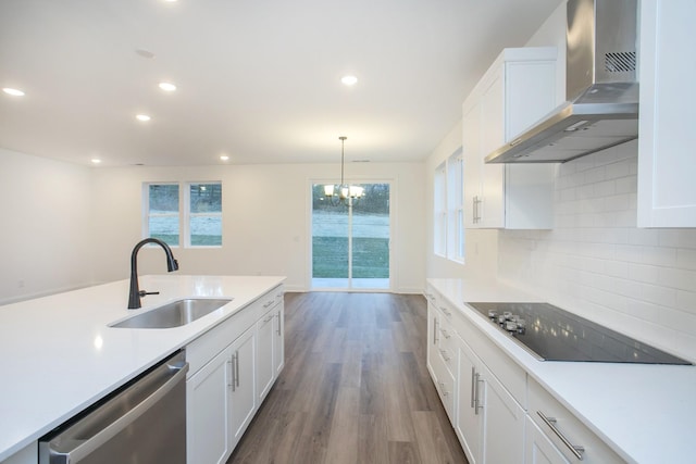 2322 Williamsport Lndg, Columbia, TN 38401 - kitchen featuring wall chimney exhaust hood, black electric stovetop, stainless steel dishwasher, wood finished floors, and white cabinets