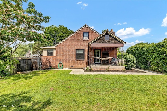 4616 Coile Rd, Knoxville, TN 37918 - back of property featuring a chimney, brick siding, and crawl space