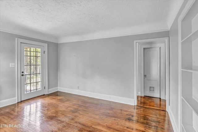 4616 Coile Rd, Knoxville, TN 37918 - spare room with a textured ceiling and wood finished floors